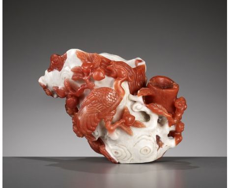 A CARNELIAN AGATE 'PHOENIX AND LINGZHI' VASE, QING DYNASTY 清代紅玉髓鳳凰如意福壽瓶China, 18th-19th century. The vessel with two receptac