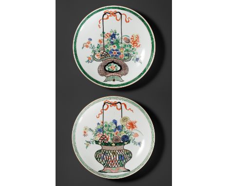 TWO FAMILLE VERTE 'FLOWER BASKET' DISHES, QING DYNASTY 清代一對五彩花籃紋碟China, 18th - 19th century. Each finely painted in bright en
