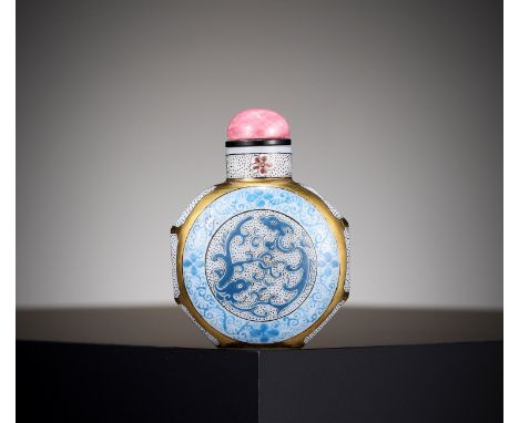 † A GILT AND ENAMELED GLASS 'CHILONG' SNUFF BOTTLE, REPUBLIC PERIOD 民國鎏金琺琅彩開光螭龍紋料器鼻烟壺China, 1912-1949. Of octagonal form, ris