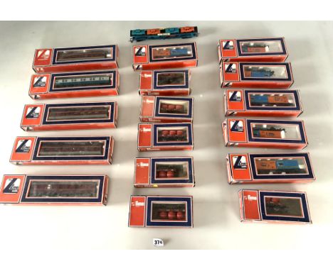 16 boxed Lima trains, trucks and wagons and unboxed Lima car transporter