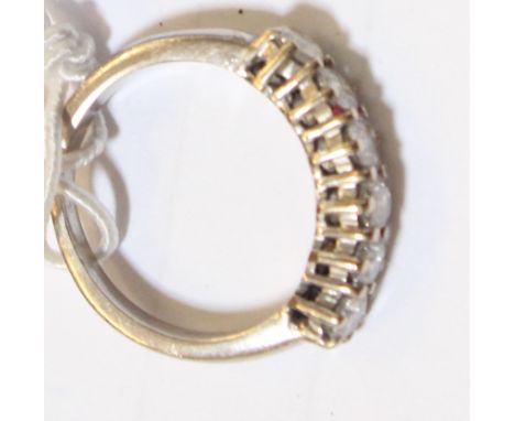 A white gold and six stone diamond half eternity ring, (shank unmarked) 