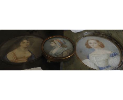 A half length portrait miniature on ivory of a young girl, signed Peter, circular, 6.5cm in diameter, another half length por