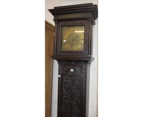 A Victorian oak longcase clock with brass face inscribed ‘Donisthorpe, Normanton’