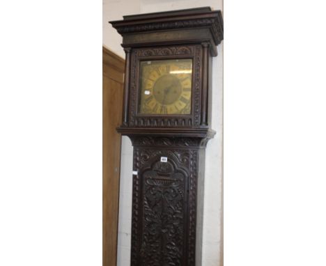 A Victorian oak longcase clock with brass face inscribed ‘Donisthorpe, Normanton’