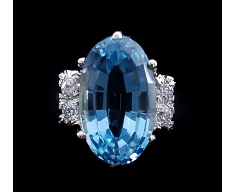 An aquamarine and diamond dress ring, the oval shaped mixed cut aquamarine weighing 8.47ct of good colour and excellent purit