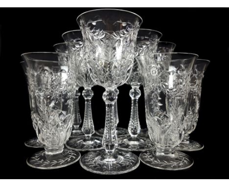 A Stourbridge 'rock crystal' type wine set possibly Webb Corbett, early 20thC, cut with leafy swags over stylized scallop she