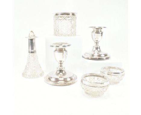 Hallmarked silver squat candlesticks and silver topped cut glass vanity items. The lot to include a pair of Edwardian squat c