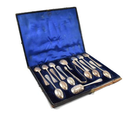 A cased Victorian hallmarked silver spoon and tong set. The set comprising of twelve teaspoons, caddy spoon, sugar spoon and 