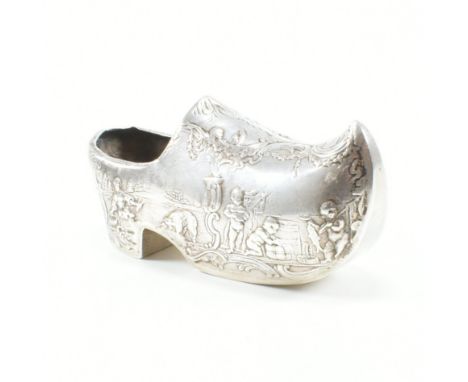 A Dutch silver novelty souvenir clog, possibly originally a pin cushion or snuff box. The clog having scenic views with cheru