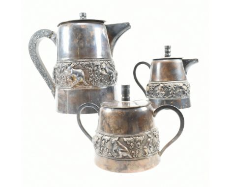 A 9999 silver three piece Burmese tea service. The tea set comprising of a tea or coffee pot, milk jug and sugar pot. The set