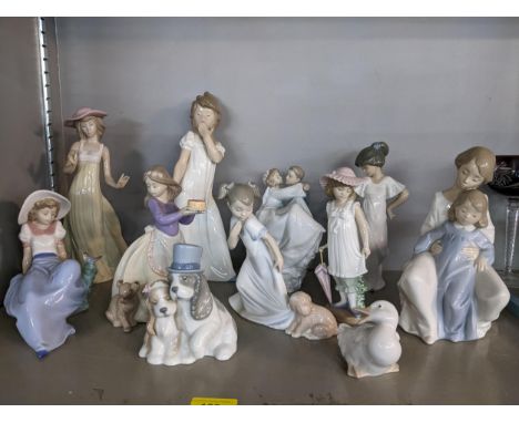 A collection of Nao porcelain figures and animal models to include a Wedding couple and one of a girl carrying a cake with an