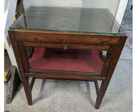A 1930's oak display cabinet with a later glass top and hinged panelled sides, on square legs, 68.5cm h x 57.5cm wLocation:FO