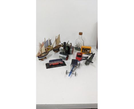 A mixed lot to include a Mamod SR1A toy tractor, a small model of a ship in a bottle sailing boats and other items, Location: