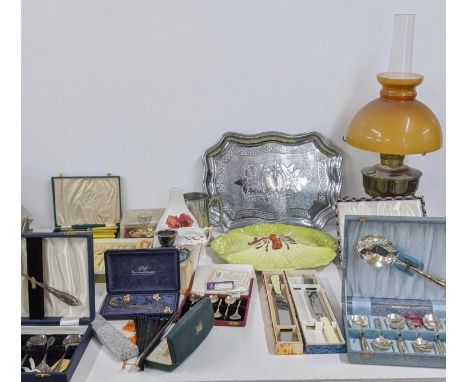 A mixed lot to include a gold plated necklace and matching earrings, boxed silver plated cutlery and flatware, an oil lamp an