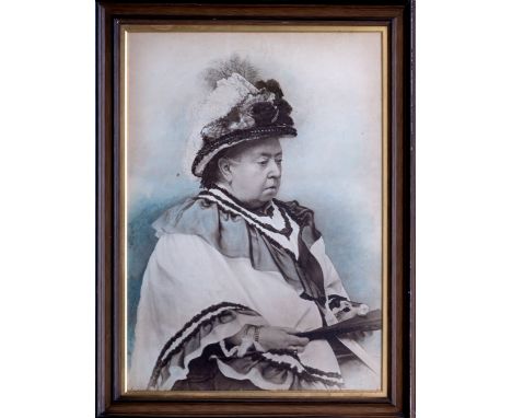 A large portrait photograph of Queen Victoria, in the last year of her life, with hand colouring, 33½ x 23½in. (85 x 59.5cm.)