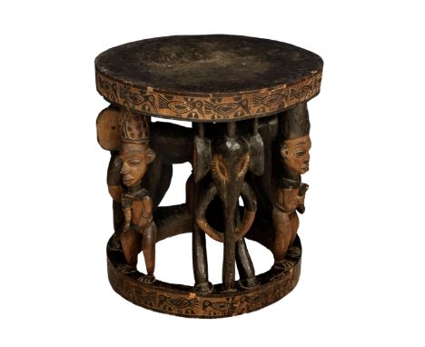 A Cameroon Royal Stool / Table, Babanki tribe, early 20th century, the slightly dished, circular top and ring base edge carve