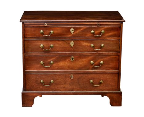 A George III mahogany straight front chest of drawers, the moulded top over a brushing slide and four long graduated drawers,