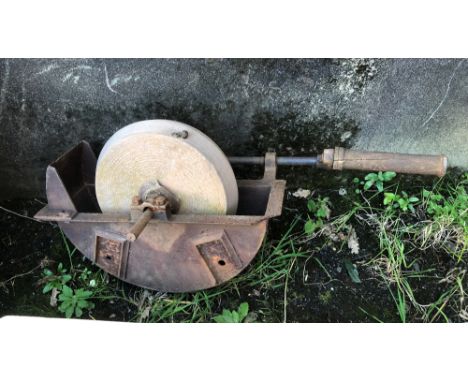 An antique cast iron and stone knife grinder, 