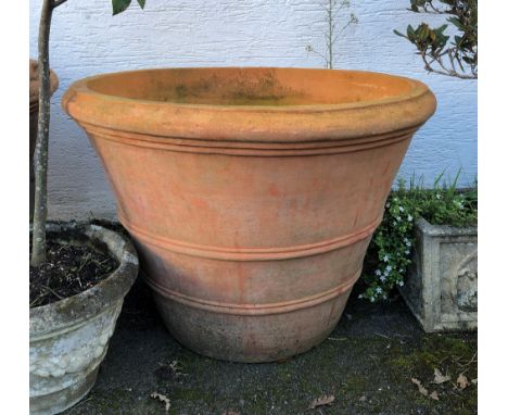 A large terracotta planter of mammoth proportions, 38in. (96.5cm.) diameter, 28in. (71cm.) high. 