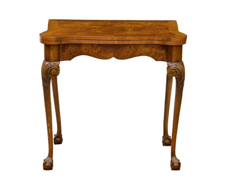 A George I style burr walnut and mahogany card table, 1930s. the mahogany cross banded top with eared front angles, lined wit