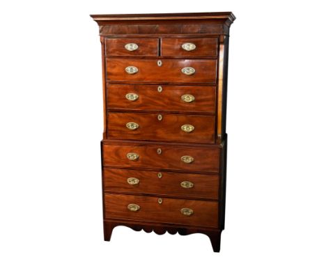 A George III mahogany chest on chest, the boxwood and ebony banded cavetto cornice over two short and three long graduated dr