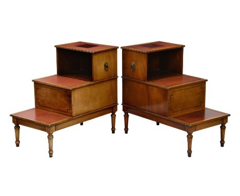 A pair of Georgian style mahogany library step tables, mid-20th century, the three steps with reeded edges and inset red gilt