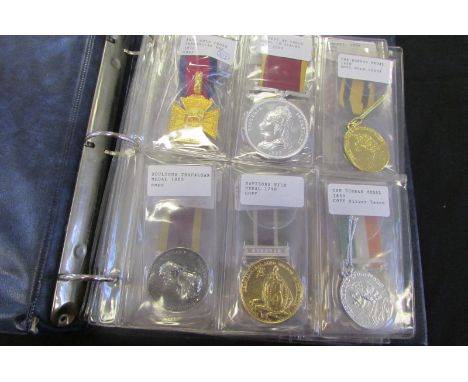 Copy medals a dealers album of 36x, some unusual, ranging from Peninsula Army Gold Cross, Empress of India, Boultons Trafalga
