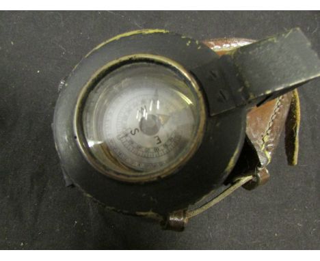 WW2 Officers fluid filed compass in its 1942 dated case with pair of binoculars in leather case