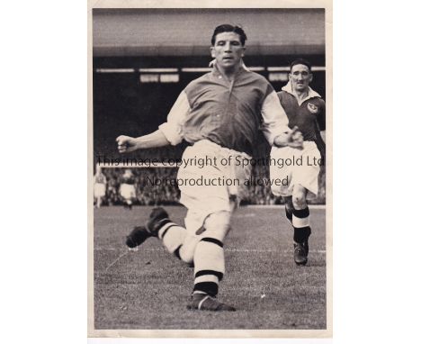 TED DRAKE / ARSENAL     An 8" X 6" B/W Press photo with stamp on the reverse of Drake in action for Arsenal v Portsmouth at H