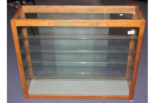 A Dinky Toys Oak Glazed Shop Display Cabinet Fitted With Four