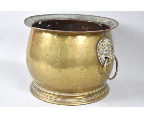 A Brass Circular planter with lion Mask Ring Handles, 25cm Diameter and 19cm High 