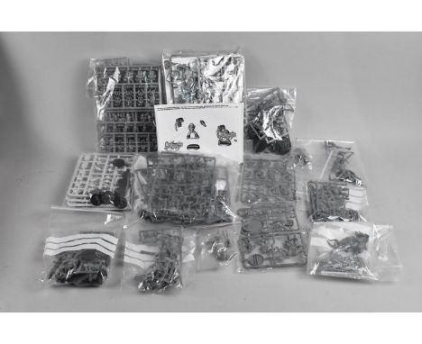 A Collection of 14 Vintage Warhammer 40,000 Plastic Figural Model Kits, Unmade and most parts on their spruces 