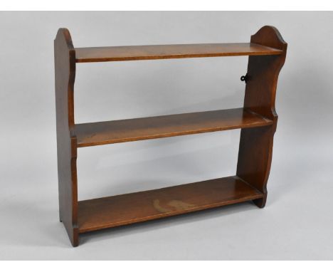 An Edwardian Mahogany Wall Hanging Three Shelf Unit, 59cms Wide 