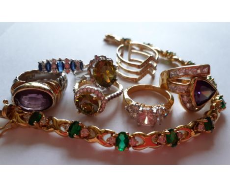 A small quantity of costume jewellery comprising 7 gold tone  and silver tone dress rings with paste and glass stones to incl