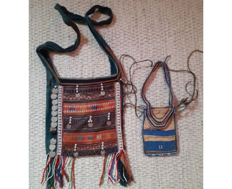 A mid 20th Century Burmese embroidered cross-over bag with Burmese coins, silver beads and multi-coloured beaded tassels toge