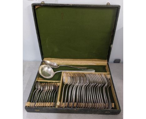 A French silver plated English pattern canteen of cutlery comprising twelve table forks, twelve table spoons, nine teaspoons 