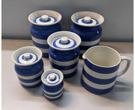 Cornish ware blue and white to include canister pot, one milk jug, a sugar bowl along with five assorted jarsLocation: 