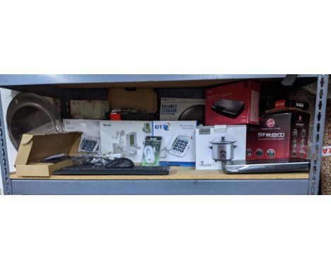 A quantity of household and computer items to include a Timeless Slow Cooker, BT Big Button phones, computer keyboards and mo