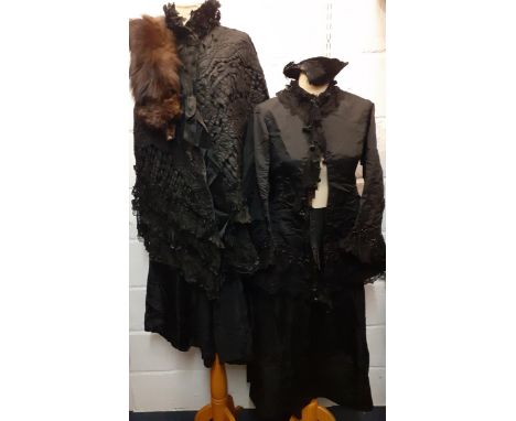 A Victorian black embroidered cape with ruffled collar, cut-out applique over-lay with layered sheer black panels towards the