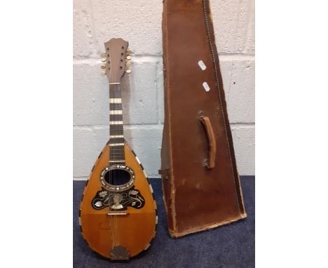 A Neapolitan mandolin circa 1900 by and stamped Mario Casella, Catania on the spruce table, with butterfly scratchplate with 