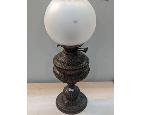 A Victorian embossed decorated brass oil lamp, with frosted shadeLocation: A3M 