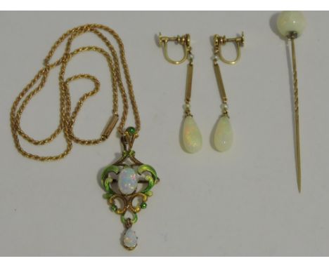 An Art Deco style enamel and opal foliate pendant, set in yellow metal on a spiral twist chain stamped 15ct; together with a 