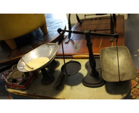 Two sets of Victorian style cast metal balance scales, a salter sprung scale and a quantity of weights.