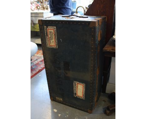 A vintage metal bound steamer trunk.