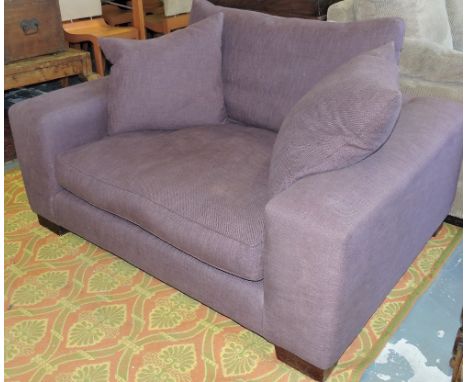 Heals, London. A modern small sofa upholstered in pale aubergine fabric on beech block feet, W 150cm.