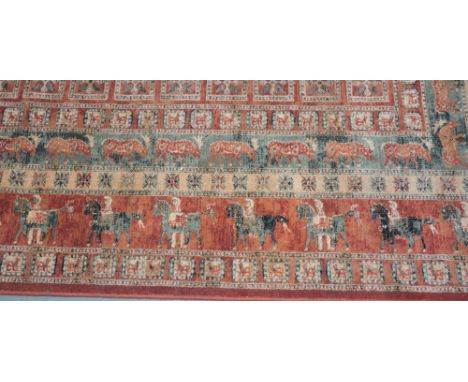 A Belgian Persian-design red ground carpet, approx. 12ft x 8ft.