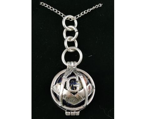 A white metal ball pendant, the Masonic themed frame enclosing a globe, marked 925, on a fine link white metal chain.
