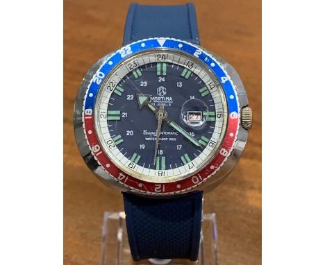 This is a great looking watch that improved with the addition of a modern rubber blue strap.; It matches the dark blue dial p