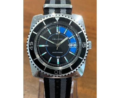 This is another 1970's Diver watch in the classic design of a square case with a round dial and bezel sitting on top.; Helico