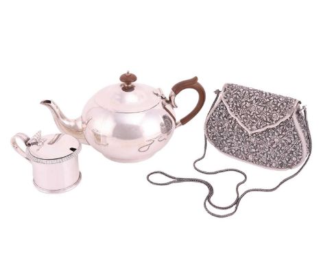 A silver teapot, circular panelled form with fruitwood handle and knop finial to domed cover. Sheffield 1929 by William Hutto